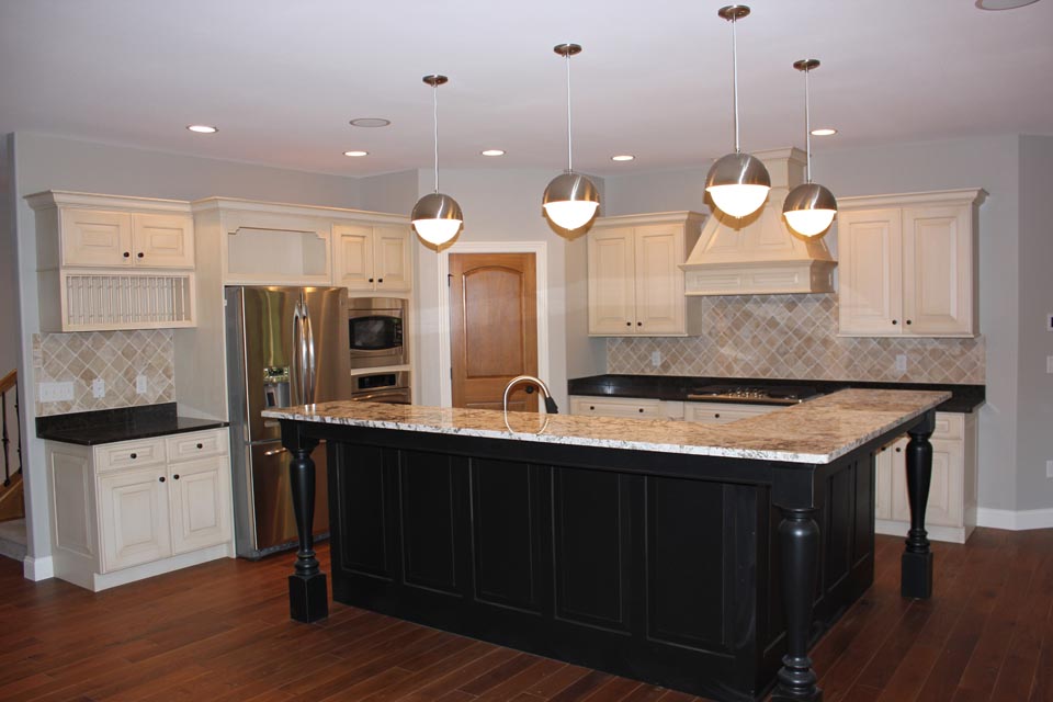 Granite countertops in custom kitchen with white custom cabinets
